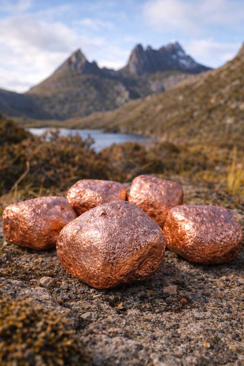 Copper plated Wombat Nuggets with a Tasmanian alpine lake and mountain background